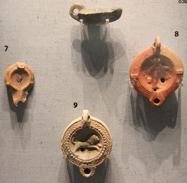 Miniature Roman era oil lamps, some found in Cirencester area, at Corinium Museum. Cirencester, England.