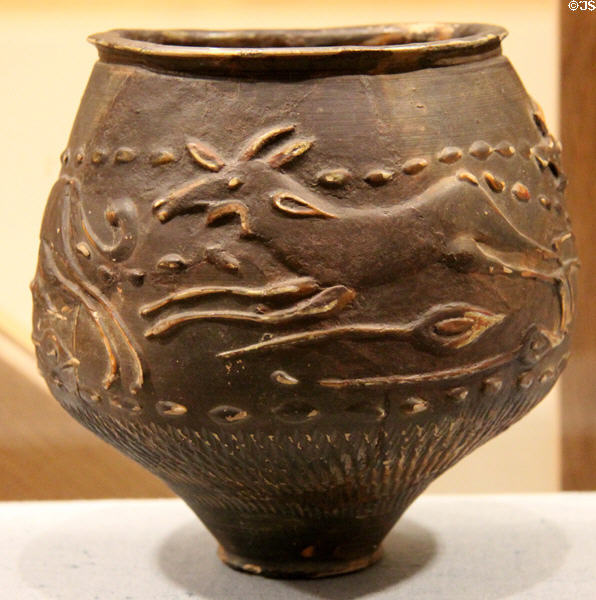 Roman era hunt cup with deer hunting scene at Corinium Museum. Cirencester, England.