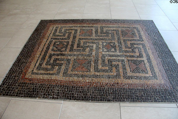 Mosaic set into floor in changing room of bathhouse in Roman townhouse in Cirencester at Corinium Museum. Cirencester, England.