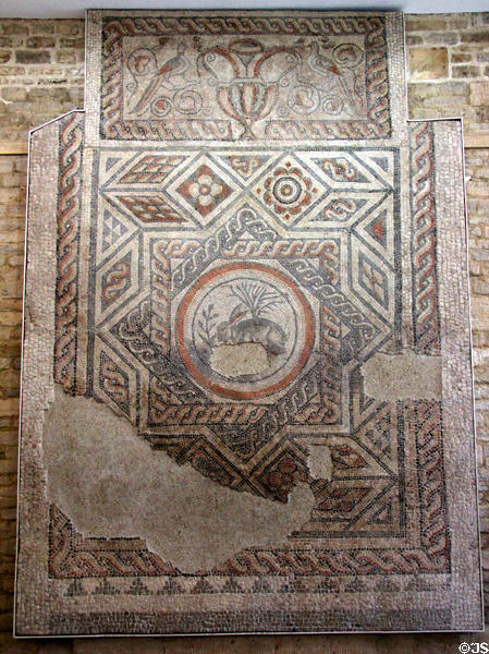 Mosaic (4thC CE) from Roman townhouse found in Cirencester with hare motif as centerpiece at Corinium Museum. Cirencester, England.
