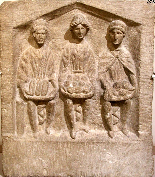 Stone relief of three mother goddesses (2nd or 3rdC CE) made of limestone & found in Cirencester at Corinium Museum. Cirencester, England.
