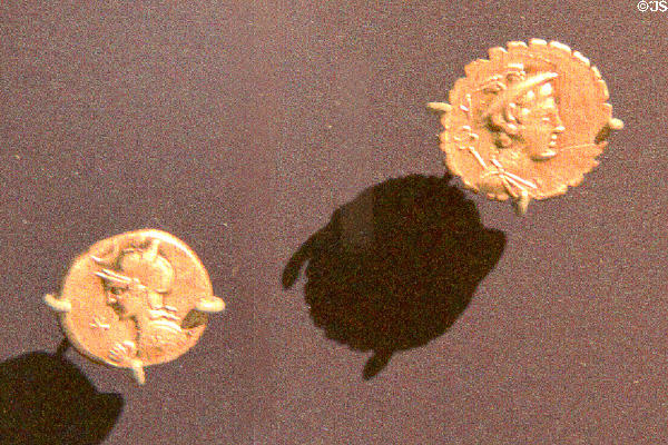 Details of two Roman coins on display at Corinium Museum. Cirencester, England.