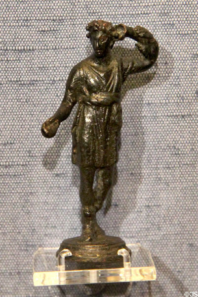 Copper-alloy figurine of Lar or Roman household god at Corinium Museum. Cirencester, England.