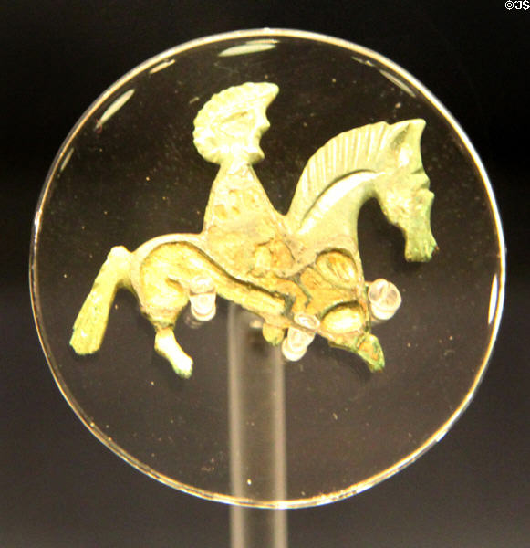Enameled horse & rider brooch (2nd & 3rdC CE) found in Cirencester at Corinium Museum. Cirencester, England.