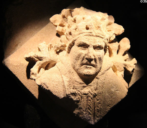 Corbel, jutting out from wall to support something above it, depicting the Pope (15thC) from St Mary's Abbey at Corinium Museum. Cirencester, England.