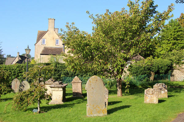 Glimpse of town from cemetery of Church of St Peter & St Paul. Northleach, England.