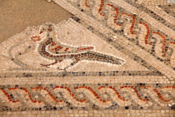 Bird figure incorporated into mosaic floor in changing room at Chedworth Roman Villa. England.