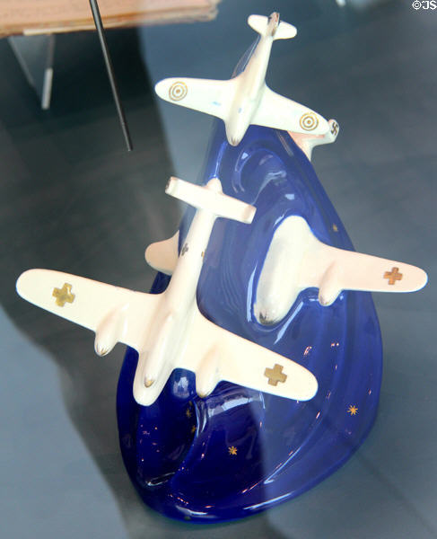 Ceramic figurine of WWII German bomber being shot down by Spitfire made around Stoke at Potteries Museum & Art Gallery. Hanley, Stoke-on-Trent, England.