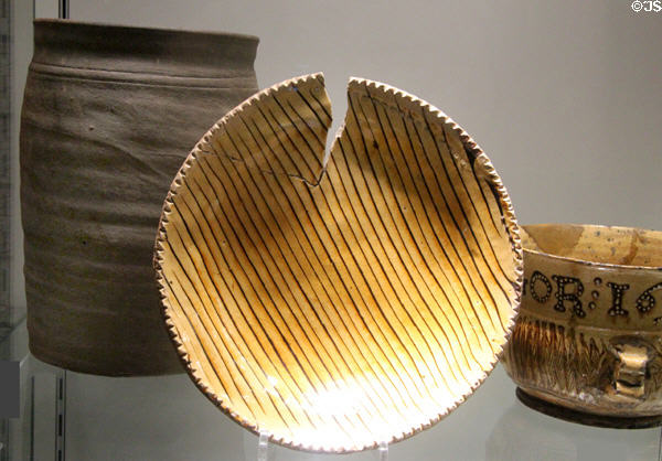 Slipware earthenware dish split during firing (c1690) from Hanley, Stoke at Potteries Museum & Art Gallery. Hanley, Stoke-on-Trent, England.