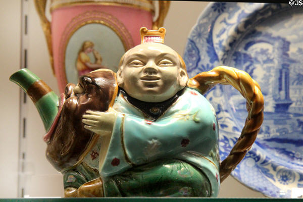 Earthenware teapot & cover in shape of Japanese character shape 1838 (1874) by Minton of Stoke-upon-Trent at Potteries Museum & Art Gallery. Hanley, Stoke-on-Trent, England.