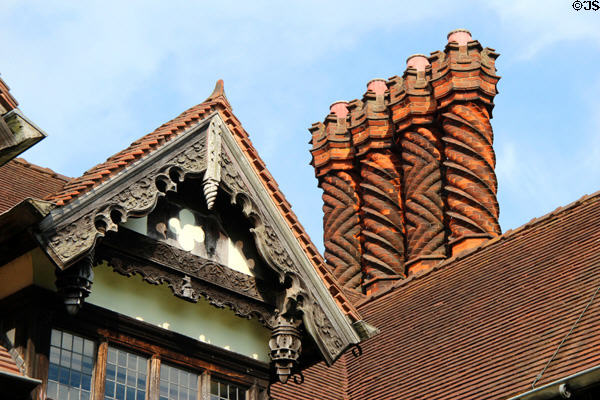 Carved verge board & spiral brick chimneys on half-timber gable at Wightwick Manor. Wolverhampton, England.