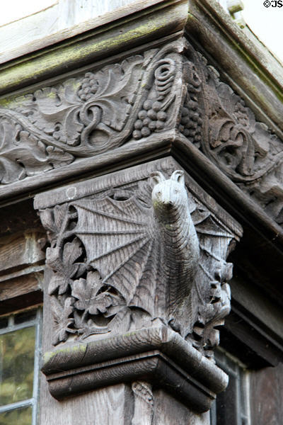 Carved wooden bat beside front door at Wightwick Manor. Wolverhampton, England.