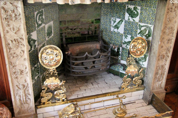 Drawing room fireplace (c1888) with tiles by William De Morgan & other Arts & Crafts metalwork at Wightwick Manor. Wolverhampton, England.