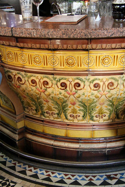 Ceramic tiles around bar at Crown Liquor Saloon. Belfast, Northern Ireland.