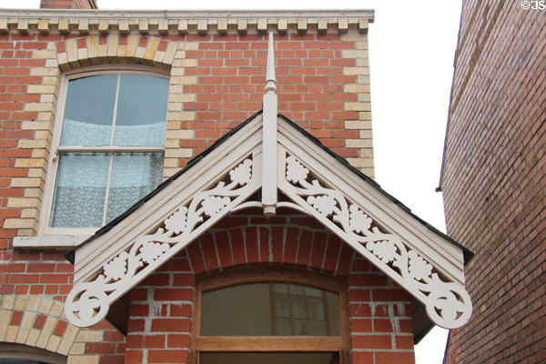 Carpenter gothic revival barge board over door at Ulster Folk Park. Belfast, Northern Ireland.