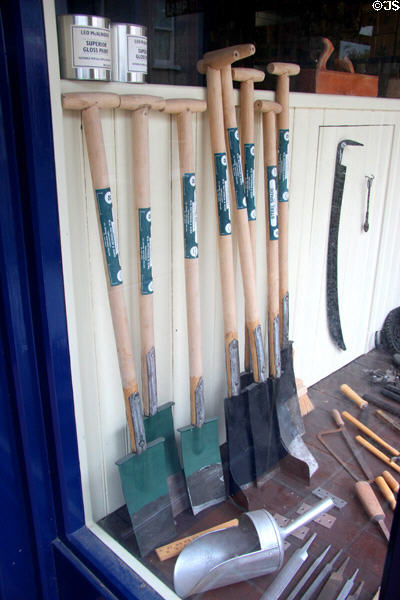 Narrow potato shovels in hardware store window at Ulster Folk Park. Belfast, Northern Ireland.