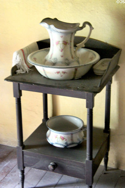 Pitcher & basin on bedroom washstand at Ulster Folk Park. Belfast, Northern Ireland.