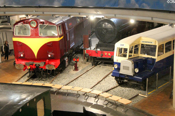 NIR diesel locomotive no. 102 'Falcon' (1970), LMS NCC steam locomotive no. 74 'Dunluce Castle' (1924) & GNR railbus no. 1 (1928) at Ulster Transport Museum. Belfast, Northern Ireland.