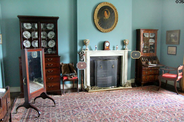 Bedroom fireplace with mirror a cheval plus chest & desk at Florence Court. Enniskillen, Northern Ireland.
