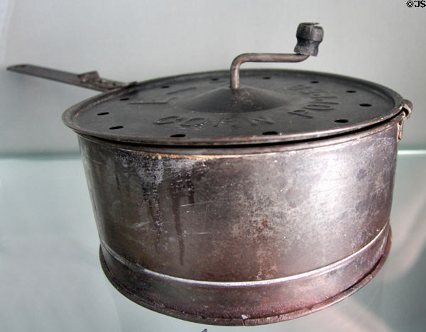Metal corn popper (c1900) from Illinois in E. Pattison Tinsmith shop at Ulster American Folk Park. Omagh, Northern Ireland.