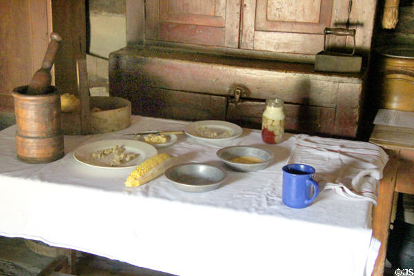 Rustic table in Log Cabin at Ulster American Folk Park. Omagh, Northern Ireland.
