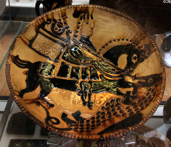 Earthenware slip glazed dish with St George & Dragon (c1720-30) by John Bird of Burslem, Staffordshire at British Museum. London, United Kingdom.