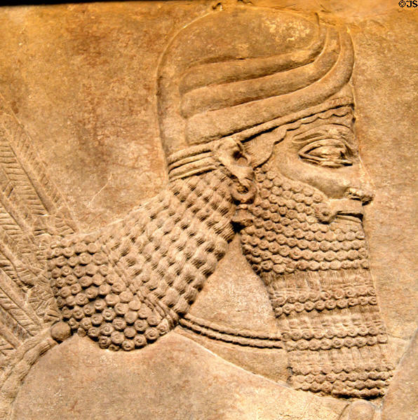 Detail of Assyrian carved panel head of King Ashurnasirpal II (c883-859 BCE) from North-West Palace of Nimrud at British Museum. London, United Kingdom.