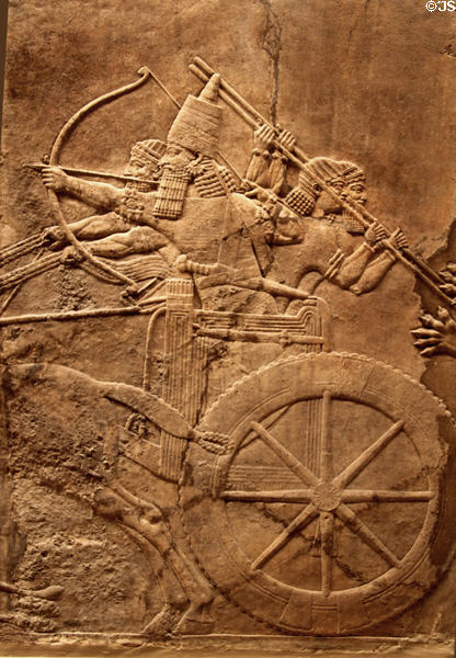 Assyrian carved panel shows lion hunt by chariot (c645-635 BCE) from North Palace of Nineveh at British Museum. London, United Kingdom.