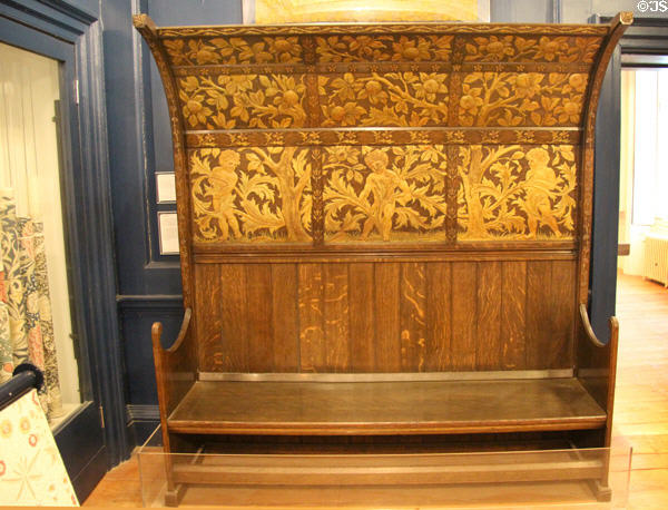 Oak settle originally for Morris's own home (1890s) by Philip Webb for Morris & Co at Morris Gallery. London, United Kingdom.