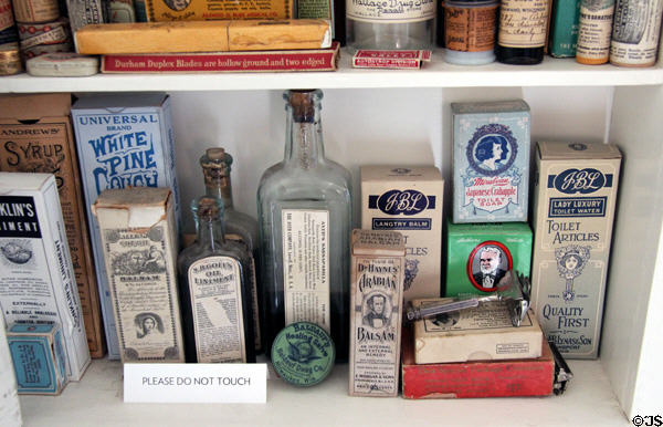 Bathroom cabinet with antique salve & toilet article boxes in Corbett House at Tucson Museum of Art. Tucson, AZ.