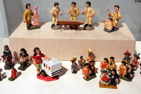 Painted earthenware people from El Salvador (20thC) showing marimba band, market vendors & wedding figures at Tucson Museum of Art. Tucson, AZ.