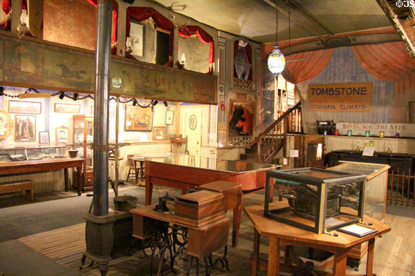 Theatre space ringed with private boxes & stage curtain at Bird Cage Theatre. Tombstone, AZ.