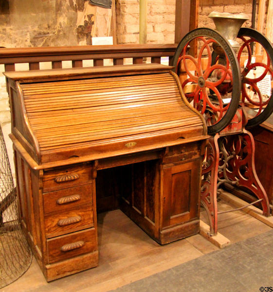 Slatted closing desk & large coffee grinder at Bird Cage Theatre. Tombstone, AZ.