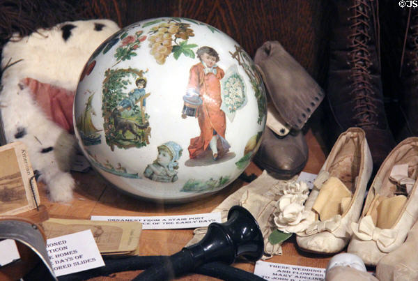 Glass ornament from stair post plus other antiques at Bird Cage Theatre. Tombstone, AZ.