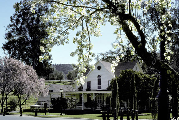 Niebaum Coppola Estate house with blooming fruit trees. Rutherford, CA.