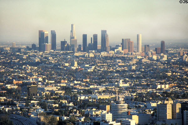 Skyline of downtown from hills above Hollywood with round Capitol Records building in foreground. Los Angeles, CA.
