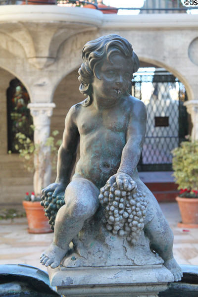 Child with grapes fountain at Mission Inn. Riverside, CA.