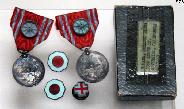 Earthquake pin given to relief donors after 1923 Tokyo earthquake at Riverside Museum. Riverside, CA.