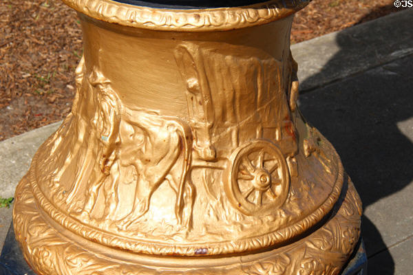 Base of street lamp with covered wagon relief at Legion of Honor Museum. San Francisco, CA.