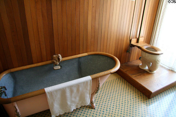 Bathroom with zinc-lined tub & ceramic toilet at Bidwell Mansion house museum. Chico, CA.