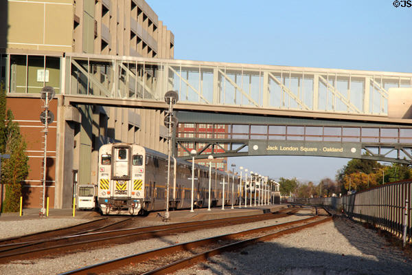 Jack London Square rail station with commuter train. Oakland, CA.
