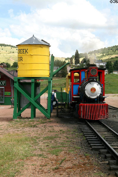 Cripple Creek Railroad steam locomotive #2 beside water tower. Cripple Creek, CO.