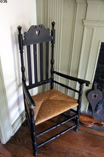 Caned armchair with heart cutout on back at Judson House. Stratford, CT.