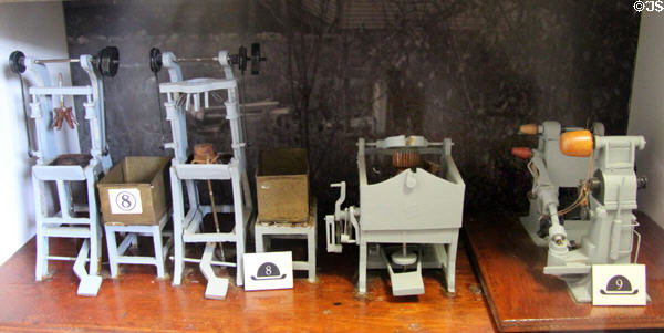Model of hat shop blocking machine to stretch felt to shape of wooden forms finished by pouncers which sand the felt to remove surface hairs at Danbury Museum & Historical Society. Danbury, CT.