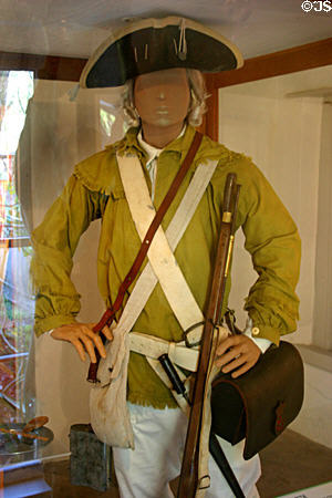 Hunting shirt, breeches, cocked hat, flintlock musket & bayonet of 1778 British East Florida Militiaman who fought to defeat American Revolution at Museum of Florida's Military. St Augustine, FL.