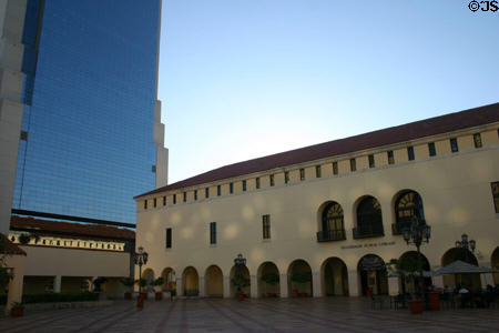 Museum Tower (1986) (29 floors) (150 West Flagler St.) over Miami-Dade Public Library. Miami, FL.