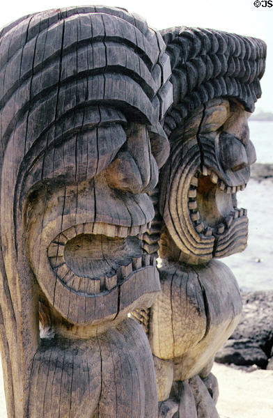 Tikis survey sea in Puuhonua O Honaunau National Historical Park. Big Island of Hawaii, HI.