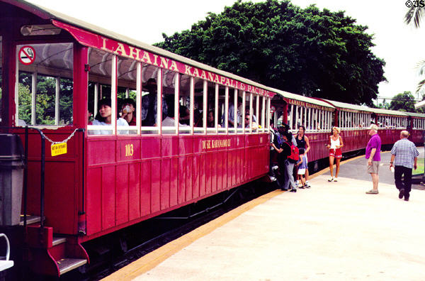 Passengers aboard sugar cane tourist train in Lahaina which runs to towns to north. Maui, HI.
