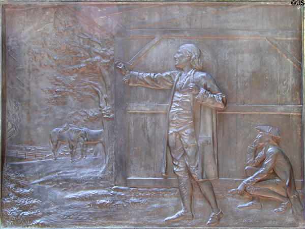 Bronze relief on base of Benjamin Franklin statue of Franklin drawing electricity from the clouds. Boston, MA.