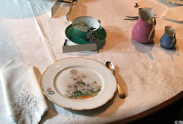 Dining room place setting with hand-painted plate (1889) at Gibson House Museum. Boston, MA.